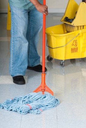 Veterans All United LLC janitor in Ewing Township, NJ mopping floor.